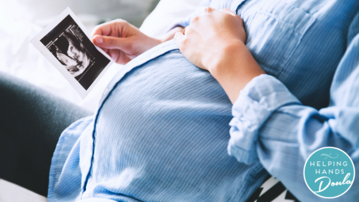 Pregnant Woman looking at her ultrasound