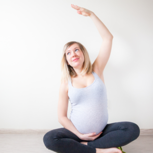 pregnant woman stretching at 40%