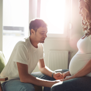 Man and pregnant woman sitting