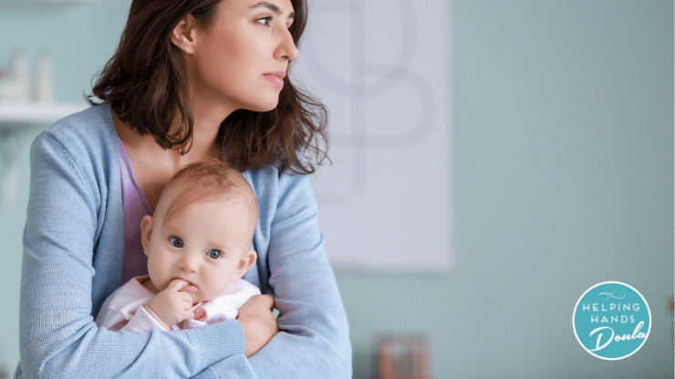 Mother looking sad sitting with baby