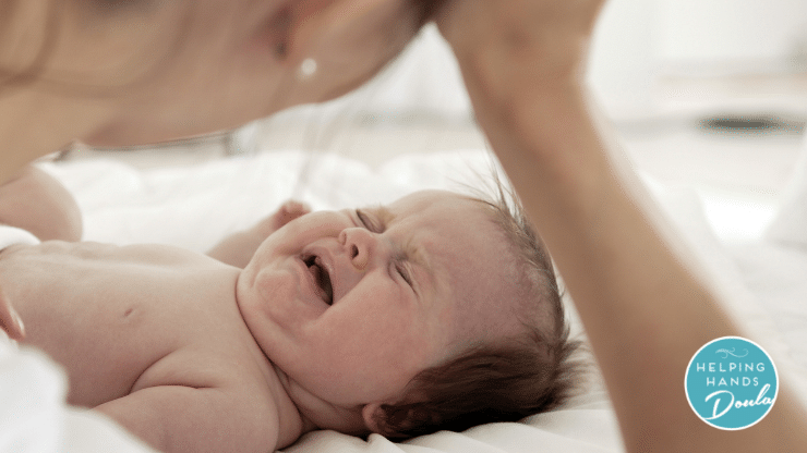 baby crying and mother trying to decide what to do