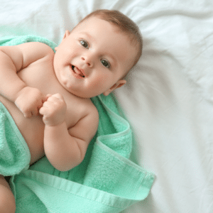 baby after bath in towel