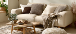 Neutral couch with plenty of cozy throw pillows