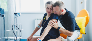 Partner supporting the birthing parent during labour